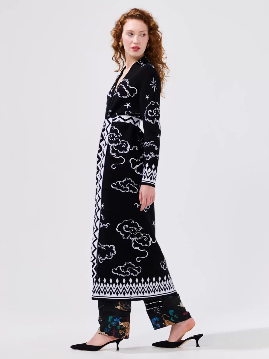 What daydreams are made of. Wrap up in this sumptuous monochrome 100% cotton jacquard duster, decorated with white fluffy clouds and graphic stars. Finished with a contrast zig zag hem, this bespoke Hayley Menzies design is digitally printed for a unique, dreamlike effect. Wear open, belted or unbelted over a pair of our patterned trousers.